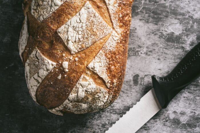 Sourdough Bread On A Table With A Knife