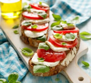 Sourdough bread toast with tomato cheese and basil